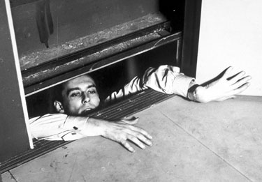 Julien Tavernier (Maurice Ronet) finds himself in a tight squeeze in French crime classic