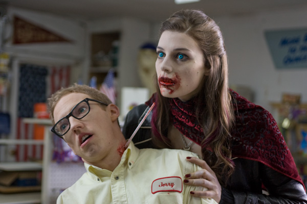 Jennifer finds a novel way to get a drink in rock and roll vampire comedy SUCK