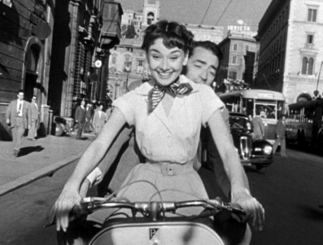 Audrey Hepburn and Gregory Peck go for a romantic spin through Rome in William Wyler classic