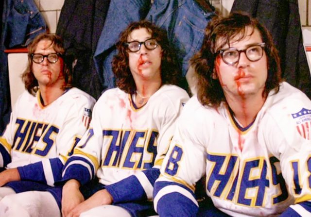 The Hanson Brothers revel in some old-time hockey in SLAP SHOT