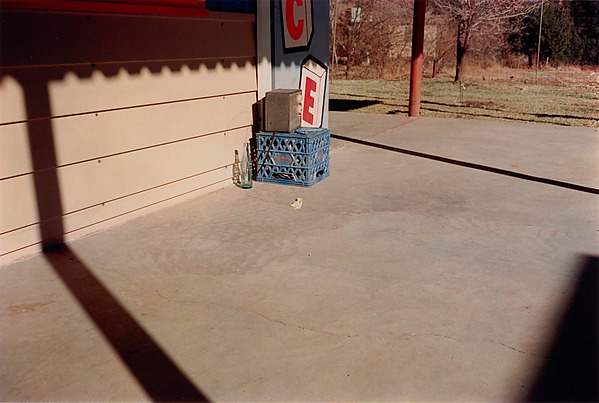 William Eggleston, Untitled (Bottle on Cement Porch), dye-transfer print, 1965-74, printed 2002 (© Eggleston Artistic Trust)