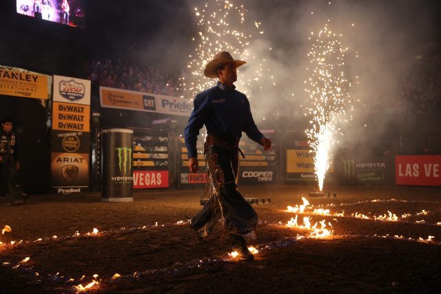 Sean Willingham, Fire, Pyro, in the opening during the third round of the Billings PBR 25th Anniversary Unleash the Beast. Photo by Andy Watson